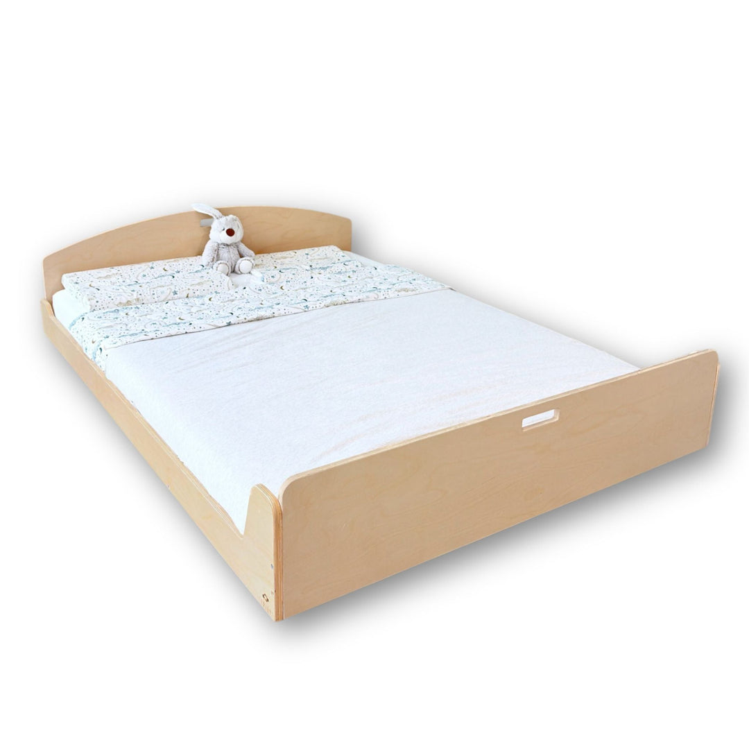 Children's bed with white mattress and teddy bear on a light beige background, labeled 'Full' and 'New'.