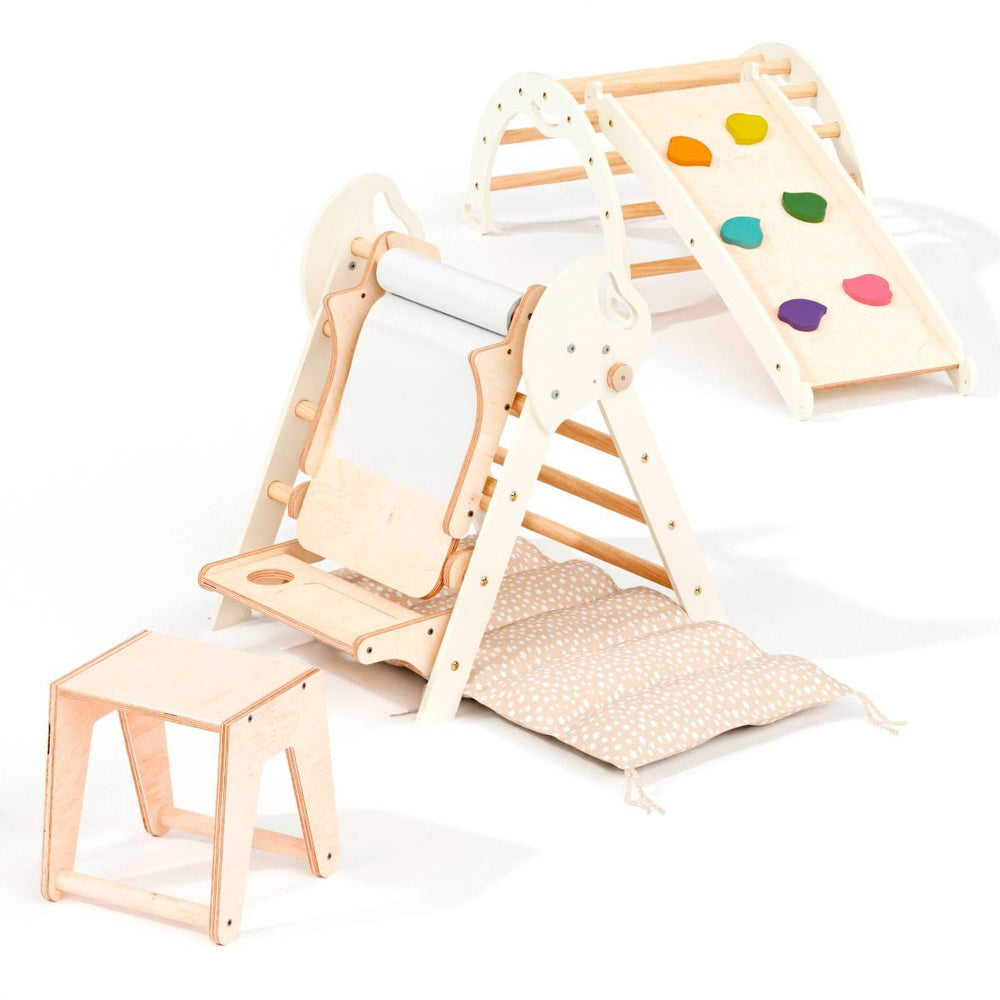 Children's wooden play set with slide, steps, and colorful heart-shaped mat on a white background