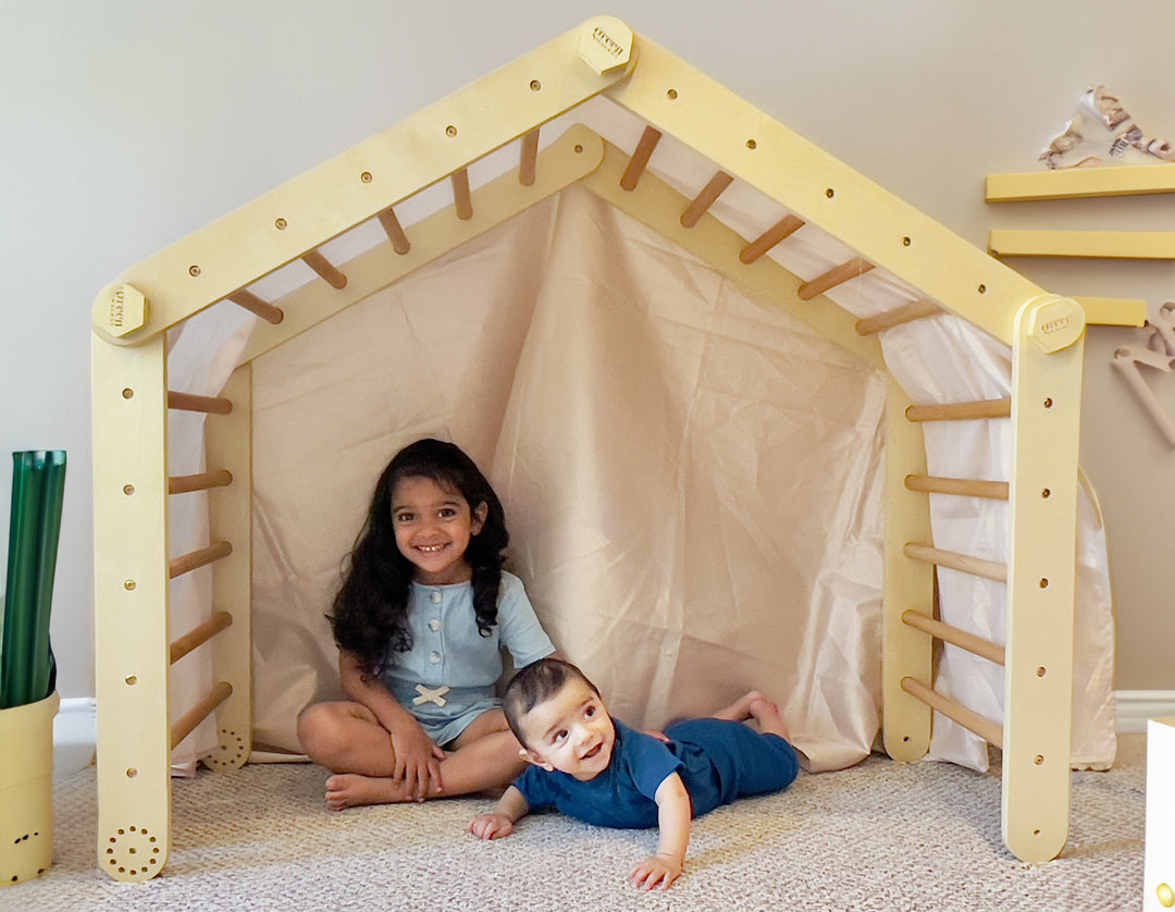 Children Playing Under A Wooden Pikler Triangle