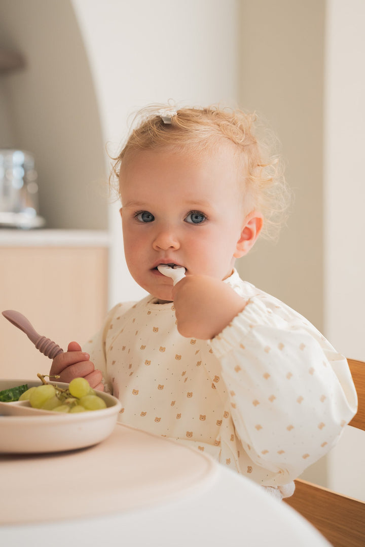 Long-sleeved bib with front pocket