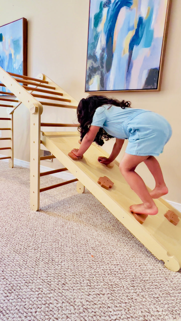 Kid Climbing On A Montessori Pikler Triangle