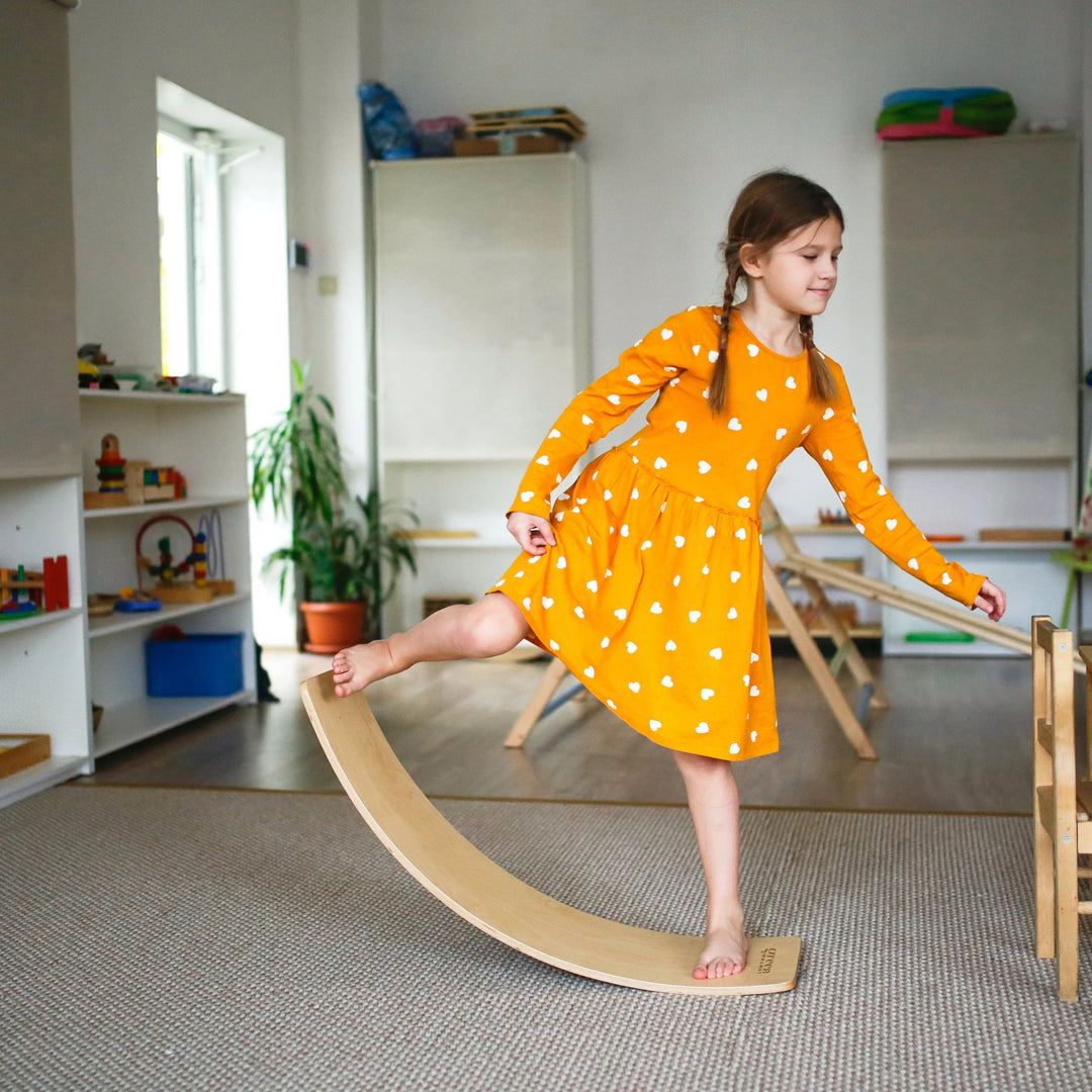 Girl Playing With A Balance Board
