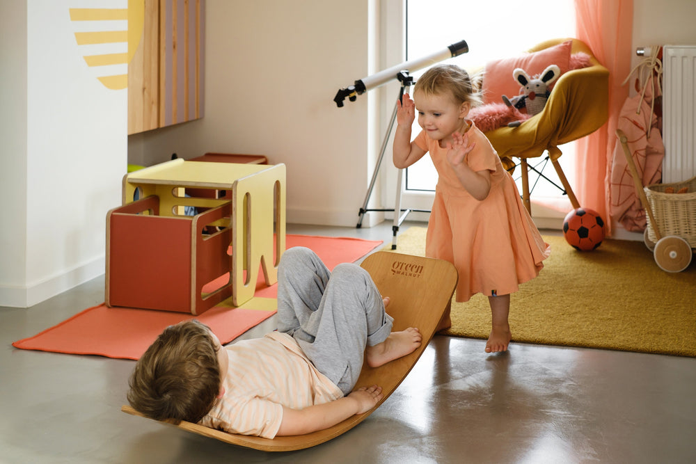 Kids Playing With A Balance Board